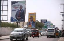 Motorists drive along a street with the campaign billboards of Somalia's Presidential candidates in Somalia's capital Mogadishu, February 6, 2017. PHOTO BY REUTERS/Feisal Omar