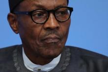 Nigerian President Muhammadu Buhari listens as British Prime Minister Cameron opens the international anti-corruption summit in London, England, May 12, 2016. PHOTO BY REUTERS/Dan Kitwood