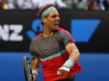 Rafael Nadal of Spain celebrates defeating Kei Nishikori of Japan during their men's singles match at the Australian Open 2014 tennis tournament in Melbourne