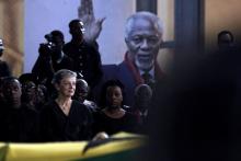 Nane Maria Annan, wife of the former United Nations Secretary General Kofi Annan, who died in Switzerland, sits in front of the casket of her husband lying in state at the International Conference Centre ahead of the state funeral in Accra, Ghana, September 12, 2018. PHOTO BY REUTERS/Francis Kokoroko