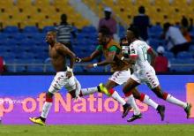 Burkina Faso's Niguimbe Perjuce celebrates his goal. PHOTO BY REUTERS/Amr Abdallah Dalsh