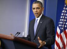 U.S. President Barack Obama addresses his year-end news conference in the White House briefing room in Washington