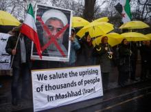 Opponents of Iranian President Hassan Rouhani hold a protest outside the Iranian embassy in west London, December 31, 2017. REUTERS/Eddie Keogh