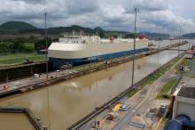 A cargo ship is crossing through the Miraflores locks, a day before the inauguration of the Panama Canal Expansion project, in Panama City, Panama, June 25, 2016. PHOTO BY REUTERS/Alberto Solis