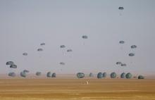 American and Egyptian paratroopers are air-dropped from a C-130 Hercules aircraft during exercise Bright Star 2007, at Kum Oshim 90 km (56 miles) south of Cairo, Egypt, November 8, 2007. PHOTO BY REUTERS/Nasser