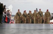 Paratroopers with the 1st Brigade Combat Team, 82nd Airborne Division, march up the ramp as they return home from Afghanistan at Pope Army Airfield in Fort Bragg, North Carolina, November 5, 2014. PHOTO BY REUTERS/Chris Keane