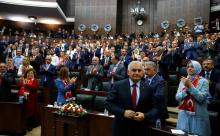 Turkey's Prime Minister Binali Yildrim (front) makes his way to address members of parliament from his ruling AK Party (AKP) during a meeting at the Turkish parliament in Ankara, Turkey, July 19, 2016. PHOTO BY REUTERS/Umit Bektas