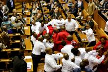 Security officials remove members of the Economic Freedom Fighters during President Jacob Zuma's State of the Nation Address (SONA) to a joint sitting of the National Assembly and the National Council of Provinces in Cape Town, South Africa, February 9, 2017. PHOTO BY REUTERS/Sumaya Hisham