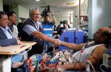 The WHO Representative in Yemen Dr Nevio Zagaria shakes hands with a patient during his visit Hemodialysis Center in Al - Thawra hospital in Sanaa, Yemen, September 13, 2018. PHOTO BY REUTERS/Mohamed al-Sayaghi