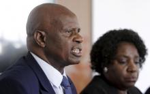 Zimbabwe's Finance Minister Patrick Chinamasa (L) addresses a media conference after meeting International Monetary Fund (IMF) Executive Director for Africa Chileshe Kapwepwe (R) in Harare, September 7, 2015. PHOTO BY REUTERS/Philimon Bulawayo