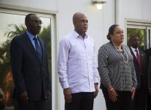 Haiti's Prime Minister Evans Paul, Haiti's President Michel Martelly and Martelly's wife Sophia (L-R) stand together during a ceremony in Port-au-Prince, January 19, 2015. PHOTO BY REUTERS/Jeanty Junior Augustin
