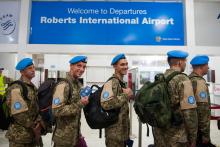 Members of the Ukrainian Aviation Unit deployed in the United Nations Mission in Liberia (UNMIL) wait to check-in at the Roberts international Airport, before flying back to Ukraine, outside Monrovia, Liberia, February 9, 2018. PHOTO BY REUTERS/Albert Gonzalez Farran/UNMIL