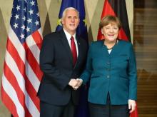 German Chancellor Angela Merkel poses for a picture with U.S. Vice President Mike Pence before their meeting at the 53rd Munich Security Conference in Munich, Germany, February 18, 2017. PHOTO BY REUTERS/Michael Dalder