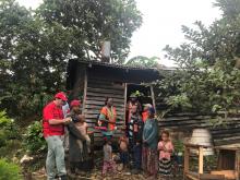International Federation of Red Cross and Red Crescent Societies members talk to people after an earthquake and aftershocks in Nipa-Kutubu district, Papua New Guinea March 6, 2018. PHOTO BY REUTERS/International Federation of Red Cross and Red Crescent Societies (IFRC)