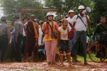 People react as Myanmar authorities demolish huts occupied by thousands of informal settlers on the cityÕs suburbs, to clear the land for development, in Hlegu township outside Yangon, Myanmar, June 12, 2017. PHOTO BY REUTERS/Soe Zeya Tun