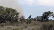 People gather near a site where an Aeromexico-operated Embraer passenger jet crashed in Mexico's northern state of Durango, July 31, 2018, in this still image taken from a video obtained from social media. PHOTO BY REUTERS/Contacto Hoy