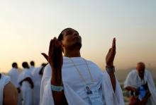A Muslim pilgrim prays on Mount Mercy on the plains of Arafat during the annual haj pilgrimage, outside the holy city of Mecca, Saudi Arabia, September 11, 2016. PHOTO BY REUTERS/Ahmed Jadallah