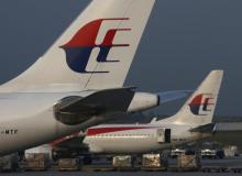 Malaysia Airlines planes sit on the tarmac at Kuala Lumpur International Airport, July 21, 2014. PHOTO BY REUTERS/Edgar Su
