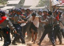 Police hit a student protester during violence in Letpadan, March 10, 2015. PHOTO BY REUTERS/Soe Zeya Tun