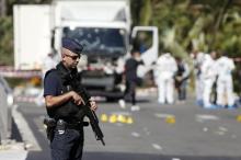 French police secure the area as the investigation continues at the scene near the heavy truck that ran into a crowd at high speed killing scores who were celebrating the Bastille Day July 14 national holiday on the Promenade des Anglais in Nice, France, July 15, 2016. PHOTO BY REUTERS/Eric Gaillard