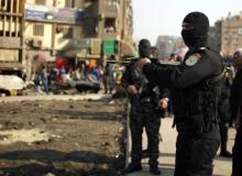 Police stand guard for possible protests in the eastern suburb of Mataryia in Cairo, November 28, 2014. PHOTO BY REUTERS/Asmaa Waguih
