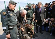EU Commissioner of Migration Dimitris Avramopoulos poses for a picture with border police from Finland during the official launch of the European Union's Border and Coast Guard Agency at a border crossing on the Bulgarian-Turkish border in Kapitan Andreevo, Bulgaria, October 6, 2016. PHOTO BY REUTERS/Stoyan Nenov
