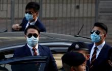 Three of the seven police officers, Police Constable Lau Hing-pui (front L), Wong Wai-ho (R) and Chan Siu-tan (back), charged in connection with the beating of a protester during Occupy Central pro-democracy demonstrations, arrive at a court in Hong Kong, China February 14, 2017. PHOTO BY REUTERS/Bobby Yip
