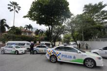Police cars form a roadblock outside the sealed off North Korea embassy in Kuala Lumpur, Malaysia, March 7, 2017. PHOTO BY REUTERS/Lai Seng Sin
