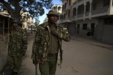 Police officers patrol a street in the Majengo area of Mombasa, April 5, 2014. PHOTO BY REUTERS/Siegfried Modola