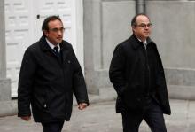 Catalan politicians Josep Rull (L) and Jordi Turull arrive together to the Supreme Court after being summoned and facing investigation for their part in Catalonia's bid for independence in Madrid, Spain, March 23, 2018. PHOTO BY REUTERS/Juan Medina