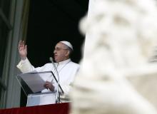 Pope Francis waves during his Sunday Angelus prayer in Saint Peter's Square at the Vatican, January 11, 2015. PHOTO BY REUTERS/Stefano Rellandini