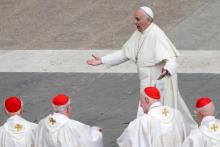 Pope Francis reacts as he is greeted by Cardinals at the end of a mass for the Jubilee of Priests at St. Peter's Square at the Vatican, June 3, 2016. PHOTO BY REUTERS/Alessandro Bianchi
