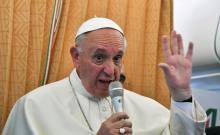 Pope Francis speaks to journalists on his flight back to Rome following a visit at Armenia, June 26, 2016. PHOTO BY REUTERS/Tiziana Fabi