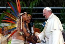 Pope Francis (R) greets members of an indigenous group from the Amazon region, at the Coliseum Madre de Dios, in Puerto Maldonado, Peru. PHOTO BY REUTERS/Henry Romero