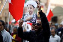 A protester holding a portrait of Ali Salman, the head of Bahrain's main opposition party Al Wefaq, shout anti-government slogans during a protest demanding Salman's release in the village of Bilad Al Qadeem south of Manama, January 12, 2015. PHOTO BY REUTERS/Hamad I Mohammed