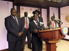 South Sudan Second Vice President James Wani Igga (C), flanked by South Sudan President Salva Kiir (R) and First Vice President Riek Machar (L), addresses a news conference at the Presidential State House in Juba, South Sudan, July 8, 2016. PHOTO BY REUTERS/Stringer