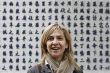 Spain's Princess Infanta Cristina (C) smiles she visits Den Do temple in Bac Ninh province near Hanoi