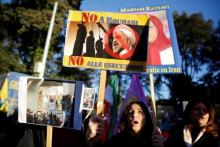 Opponents of Iranian President Hassan Rouhani hold a protest outside the Iranian embassy in Rome, Italy, January 2, 2018. PHOTO BY REUTERS/Tony Gentile