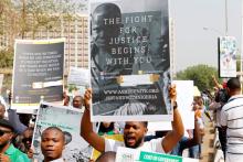 People hold signs as they take part in a protest march against Nigeria's President Muhammadu Buhari in Abuja, Nigeria, Febuary 6, 2017. PHOTO BY REUTERS/Afolabi Sotunde
