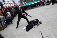 Pro-Palestinian protesters lie on the ground as they take part in a demonstration organized by Al Adl wal Ihsane, a Moroccan Islamist association, in solidarity with the Palestinian people, in Casablanca, Morocco, May 20, 2018. PHOTO BY REUTERS/Youssef Boudlal