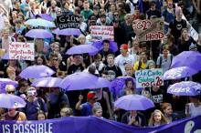 People hold banners and umbrellas as they walk during the protest demonstration at the G20 summit in Hamburg, Germany, July 7, 2017. PHOTO BY REUTERS/Fabrizio Bensch