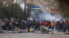 Tear gas is seen as protesters clash with riot police attempting to disperse the crowd during demonstrations against rising prices and tax increases, in Tebourba, Tunisia, January 9, 2018. PHOTO BY REUTERS/Zoubeir Souissi