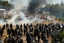 Protesters from the National Coordination of Education Workers (CNTE) teachers’ union clash with riot police officers during a protest against President Enrique Pena Nieto's education reform, in the town of Nochixtlan, northwest of the state capital, Oaxaca City, Mexico, June 19, 2016. PHOTO BY REUTERS/Jorge Luis Plata