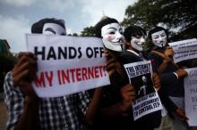 Protesters from the Anonymous India group of hackers wear Guy Fawkes masks as they protest against laws they say gives the government control over censorship of internet usage in Mumbai, June 9, 2012. PHOTO BY REUTERS/Vivek Prakash