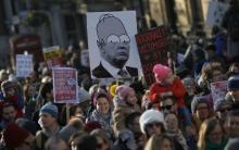 Protesters carrying banners take part in the Women's March on London, as they walk from the American Embassy to Trafalgar Square, in central London, Britain January 21, 2017. The march formed part of a worldwide day of action following the election of Donald Trump to U.S. President. PHOTO BY REUTERS/Neil Hall