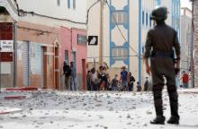 Protesters throw stones towards riot police as they demonstrate against alleged corruption in the provincial town of Imzouren, Morocco, June 2, 2017. PHOTO BY REUTERS/Youssef Boudlal