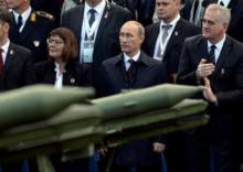 Russian President Vladimir Putin and Serbian President Tomislav Nikolic (R) attend a military parade to mark 70 years since the city's liberation by the Red Army in Belgrade, Serbia, October 16, 2014. PHOTO BY REUTERS/Vasily Maximov