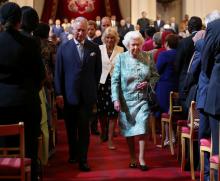 Britain's Queen Elizabeth and Prince Charles leave after the formal opening of the Commonwealth Heads of Government Meeting in the ballroom at Buckingham Palace in London, Britain, April 19, 2018. PHOTO BY REUTERS/Yui Mok
