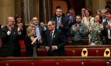 Newly elected Catalonia regional president, Quim Torra, is applauded by fellow party members and pro-indpendence parties following an investiture debate at the regional parliament in Barcelona, Spain, May 14, 2018. PHOTO BY REUTERS/Albert Gea