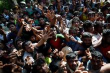 Rohingya refugees strech their hand for relief supplies given by local people in Cox’s Bazar, Bangladesh, September 16, 2017. PHOTO BY REUTERS/Mohammad Ponir Hossain